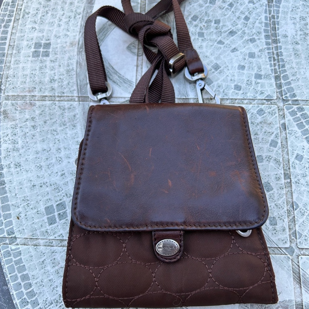 Mosey travel crossbody multiple zip compartments.